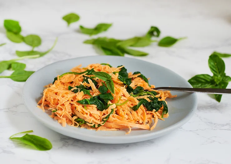 Raw sweet potato noodles with cheesy vegan sauce